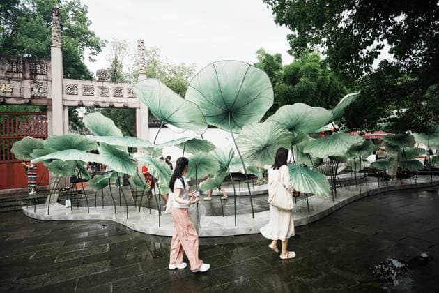 Lotus Leaf Art Installation Citizens enjoy the cool breeze under an art installation composed of giant lotus leaves in Hangzhou, Zhejiang Province, China on July 5, 2026. Hangzhou Zhejiang China  Copyright: xLWx i1783267418655