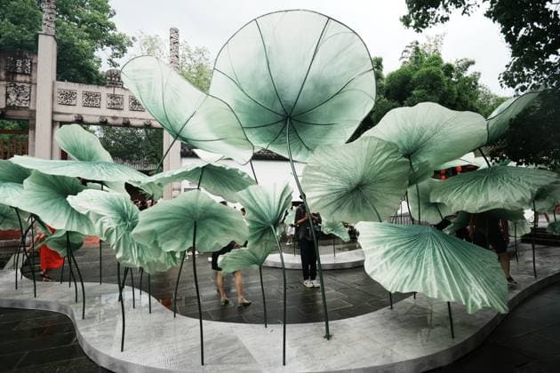 Lotus Leaf Art Installation Citizens enjoy the cool breeze under an art installation composed of giant lotus leaves in Hangzhou, Zhejiang Province, China on July 5, 2026. Hangzhou Zhejiang China  Copyright: xLWx i1783267421768
