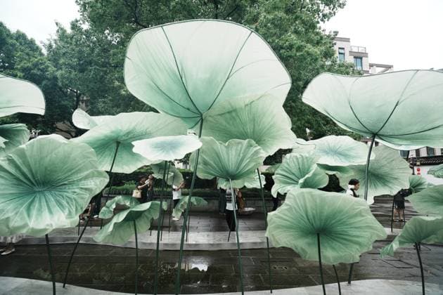 Lotus Leaf Art Installation Citizens enjoy the cool breeze under an art installation composed of giant lotus leaves in Hangzhou, Zhejiang Province, China on July 5, 2026. Hangzhou Zhejiang China  Copyright: xLWx i1783267423041