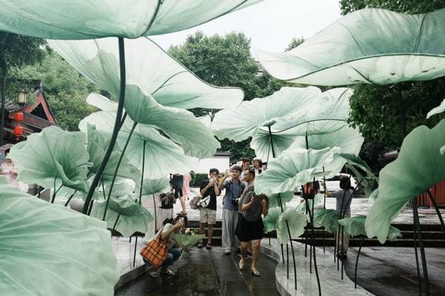 Lotus Leaf Art Installation Citizens enjoy the cool breeze under an art installation composed of giant lotus leaves in Hangzhou, Zhejiang Province, China on July 5, 2026. Hangzhou Zhejiang China  Copyright: xLWx i1783267423321
