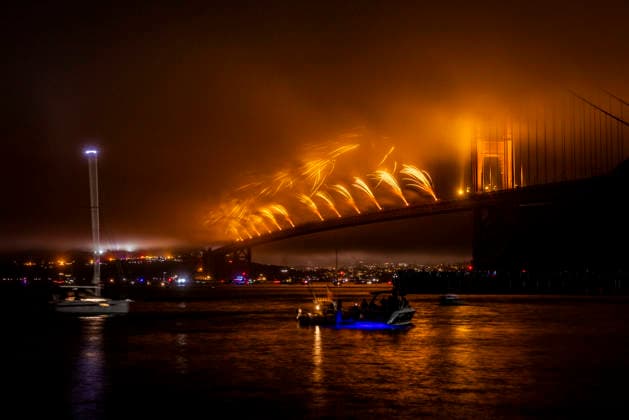 Spectators watch the fireworks display on the Golden Gate Bridge for the 250th anniversary of the United States from Horseshoe Bay in Sausalito, California on Saturday, July 4, 2026.  SFP20260704305 PETERxDASILVA
