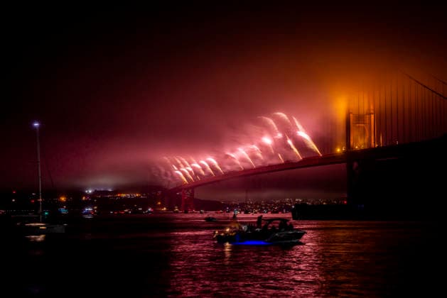 Spectators watch the fireworks display on the Golden Gate Bridge for the 250th anniversary of the United States from Horseshoe Bay in Sausalito, California on Saturday, July 4, 2026.  SFP20260704307 PETERxDASILVA