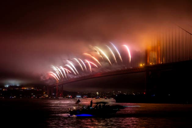 Spectators watch the fireworks display on the Golden Gate Bridge for the 250th anniversary of the United States from Horseshoe Bay in Sausalito, California on Saturday, July 4, 2026.  SFP20260704310 PETERxDASILVA