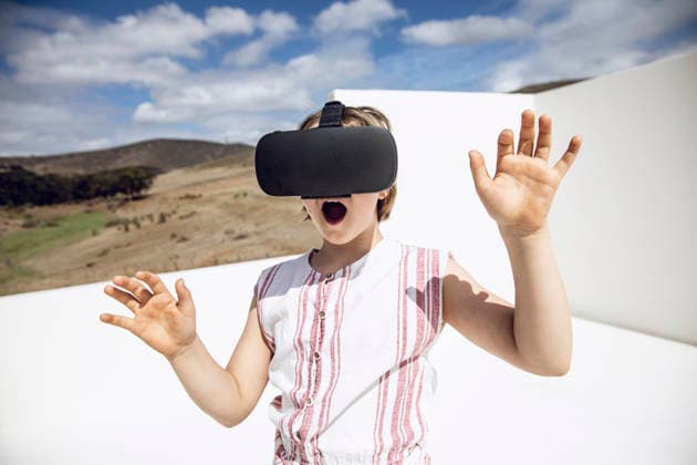 Girl looking through VR goggles in open space model released, Symbolfoto property released, MCF00508