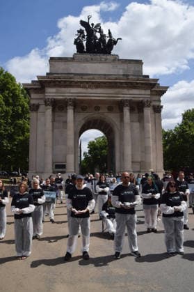 July 5, 2026, London, England, United Kingdom: Animal rights activists stand next to the Wellington Arch at Hyde Park Corner during a vigil by the group We Stand For The Animals for the billions of animals exploited, abused and killed by humans for food, clothing, entertainment and other areas of human activity. The activists held pictures of various species as well as bodies of real animals, who died of natural causes, in remembrance of animals worldwide and in protest against speciesism. London United Kingdom  - ZUMAv130 20260705_zip_v130_014 Copyright: xVukxValcicx