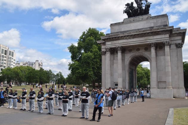 July 5, 2026, London, England, United Kingdom: Animal rights activists stand next to the Wellington Arch at Hyde Park Corner during a vigil by the group We Stand For The Animals for the billions of animals exploited, abused and killed by humans for food, clothing, entertainment and other areas of human activity. The activists held pictures of various species as well as bodies of real animals, who died of natural causes, in remembrance of animals worldwide and in protest against speciesism. London United Kingdom  - ZUMAv130 20260705_zip_v130_021 Copyright: xVukxValcicx
