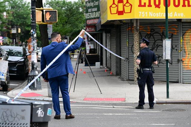 NYPD investigates shooting of officer in Brooklyn NEW YORK, UNITED STATES - JULY 5: Members of the NYPD crime scene unit process the scene where an NYPD officer was shot in the vest in the area of Nostrand Avenue and St. John’s Place in Brooklyn, New York, United States on July 5, 2026. Investigators with the NYPD Crime Scene Unit, detectives and the Force Investigation Division are staged in the area processing the scene. Ballistic damage to an unmarked NYPD vehicle that officers were sitting in was seen at the scene which had bullet holes in the front and rear windshield and the passenger side of the car. Numerous evidence markers were seen scattered at the crime scene. Kyle Mazza Anadolu New York United States. Editorial use only. Plea  Copyright: x2026xAnadoluxKylexMazzax