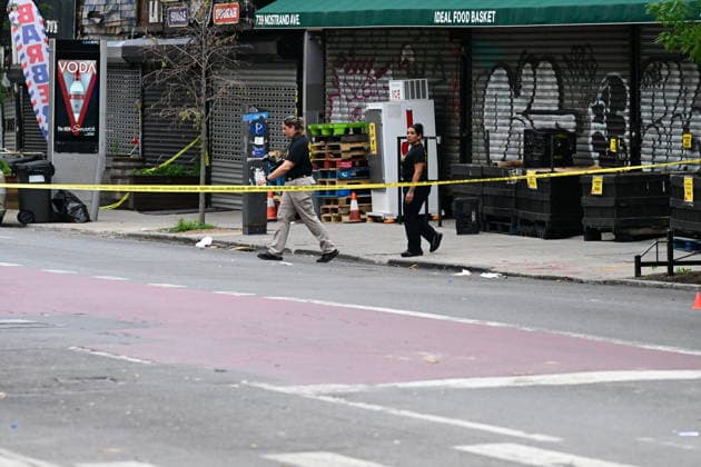 NYPD investigates shooting of officer in Brooklyn NEW YORK, UNITED STATES - JULY 5: Members of the NYPD crime scene unit process the scene where an NYPD officer was shot in the vest in the area of Nostrand Avenue and St. John’s Place in Brooklyn, New York, United States on July 5, 2026. Investigators with the NYPD Crime Scene Unit, detectives and the Force Investigation Division are staged in the area processing the scene. Ballistic damage to an unmarked NYPD vehicle that officers were sitting in was seen at the scene which had bullet holes in the front and rear windshield and the passenger side of the car. Numerous evidence markers were seen scattered at the crime scene. Kyle Mazza Anadolu New York United States. Editorial use only. Plea  Copyright: x2026xAnadoluxKylexMazzax