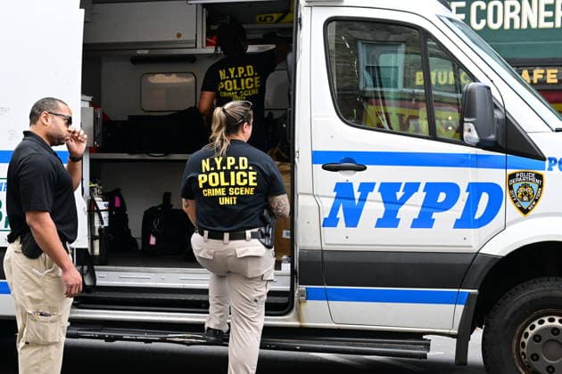 NYPD investigates shooting of officer in Brooklyn NEW YORK, UNITED STATES - JULY 5: Members of the NYPD crime scene unit process the scene where an NYPD officer was shot in the vest in the area of Nostrand Avenue and St. John’s Place in Brooklyn, New York, United States on July 5, 2026. Investigators with the NYPD Crime Scene Unit, detectives and the Force Investigation Division are staged in the area processing the scene. Ballistic damage to an unmarked NYPD vehicle that officers were sitting in was seen at the scene which had bullet holes in the front and rear windshield and the passenger side of the car. Numerous evidence markers were seen scattered at the crime scene. Kyle Mazza Anadolu New York United States. Editorial use only. Plea  Copyright: x2026xAnadoluxKylexMazzax