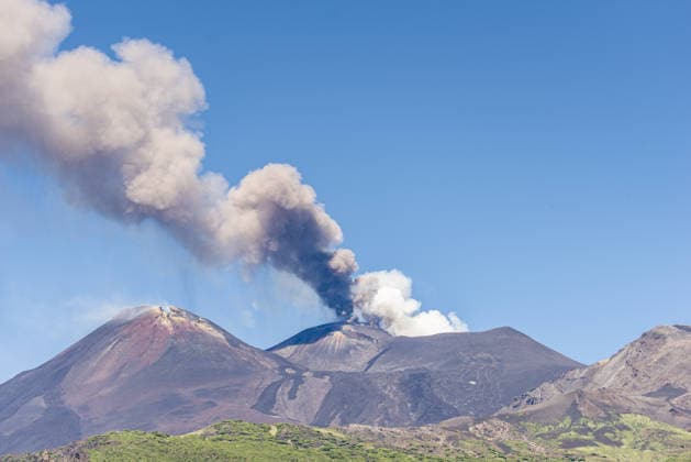 Mount Etna erupts, sending ash plume over Catania, Sicily CATANIA, ITALY - JULY 5: A towering ash plume rises from Mount Etna following the resumption of eruptive activity from a vent located on the upper eastern flank of the Voragine summit crater as the Volcano Observatory Notice for Aviation (VONA) remains at RED alert level in Catania, Sicily, Italy, on July 5, 2026. The ash emission generated an eruption column reaching approximately 1.5 kilometres above the volcano s summit, drifting toward the south and south-southeast. The effusive lava flow, which had been active since June 26, ceased on July 4, while Strombolian activity continues at the summit vent. The presence of volcanic ash prompted temporary airspace restrictions south of th  Copyright: x2026xAnadoluxSalvatorexAllegrax