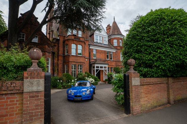 July 5, 2026, London, United Kingdom: A classic blue Renault Alpine A110, parked in the drive of a large British suburban house. The Southside Hustle Car Meet is held on Wimbledon Common in Southwest London every first Sunday of the month. This free community event attracts owners of classic cars, supercars, sports cars, and rare or modified vehicles. Car enthusiasts, photographers, and families gather to admire an impressive variety of cars, meet like-minded people, and enjoy the welcoming atmosphere in the scenic surroundings of Wimbledon Common. London United Kingdom  - ZUMAs197 20260705_aab_s197_014 Copyright: xJamesxWilloughbyx