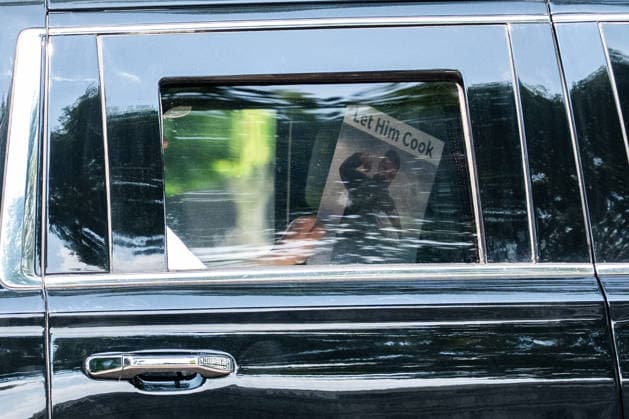 July 6, 2026 White House Pool United States President Donald J Trump holds a display of President Volodymyr Zelenskyy of Ukraine with the text ‘let him cook’ as he returns to the White House in Washington, DC, USA, on Sunday, July 5, 2026. Credit: Aaron Schwartz Pool via CNP Washington District of Columbia United States  Copyright: xPool ABACAx