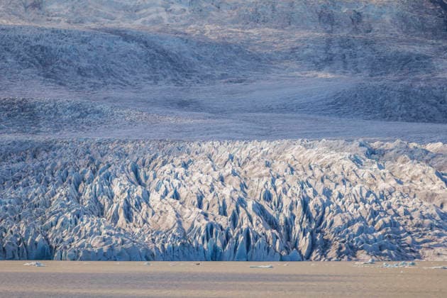 Creative Highlights World Fjallsjokull glacier flows toward the sea in Iceland, FagurholsmÃ½ri Southern Region Iceland SMAF03499
