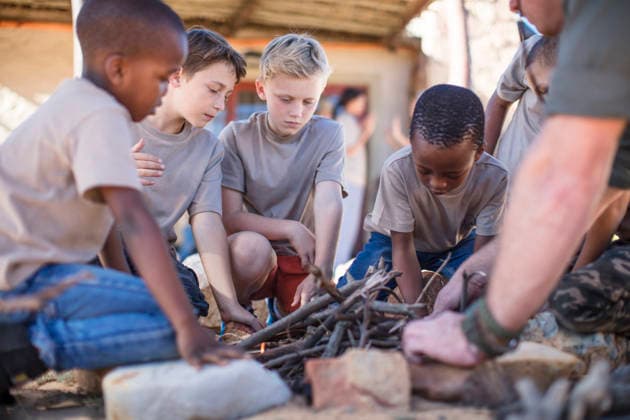 Children learning how to make a fire model released, Symbolfoto property released, Cape Town South Africa ZEF16077