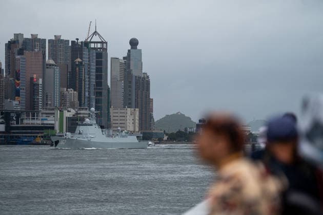 HONGKONG-DAILY People watch as Chinese People s Liberation Army (PLA) Navy guided-missile destroyer Nanning sailing through Victoria Harbor in Hong Kong, July 6, 2026. NEXPHER Vernon Yuen HONG KONG