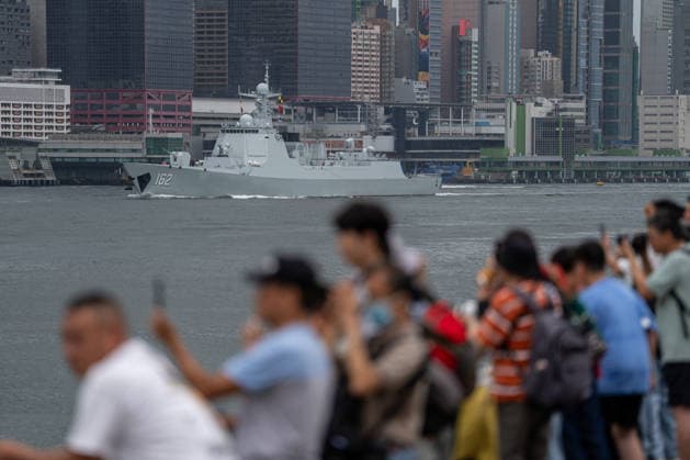 HONGKONG-DAILY People watch as Chinese People s Liberation Army (PLA) Navy guided-missile destroyer Nanning sailing through Victoria Harbor in Hong Kong, July 6, 2026. NEXPHER Vernon Yuen HONG KONG