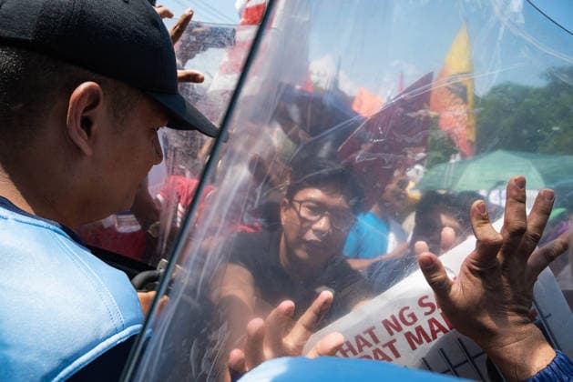 July 6, 2026, Quezon City, Quezon, Philippines: Riot police from the Philippine National Police attempted to stop the protesters from nearing the Senate but were pushed back by the protesters in a brief scuffle Quezon City Philippines  - ZUMAy102 20260706_zip_y102_006 Copyright: xKenosisxYapx