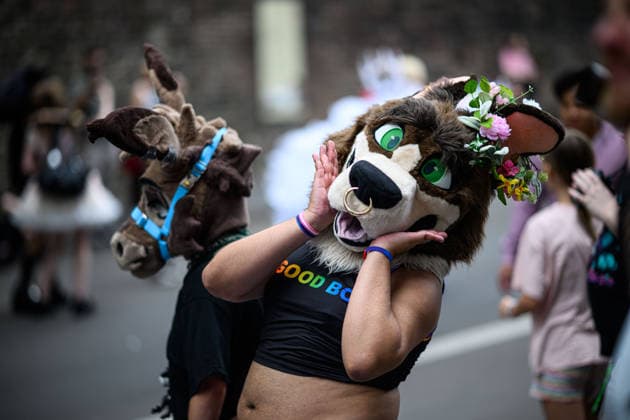 COLOGNE, GERMANY - 5 JULY, 2026: Costumed Pride parade participant in an animal mask poses playfully on a city street in Cologne, Germany. Street Parade of the Christopher Street Day (CSD), Gay Pride. LGBT  Copyright: xx