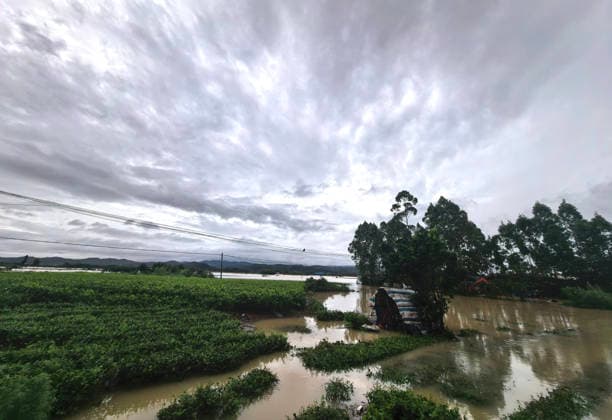 (260706) -- NANNING, July 6, 2026 -- This photo taken on July 6, 2026 shows the flooded downstream areas of the Liulan Reservoir after it was breached due to heavy rains in Hengzhou, Nanning City, south China s Guangxi Zhuang Autonomous Region. A severe breach occurred at a reservoir in Hengzhou, Nanning City, in south China s Guangxi Zhuang Autonomous Region on Monday morning, prompting an immediate escalation of the emergency response, local authorities said. Given the severe flood control situation, the city raised its emergency response for flood control from Level III to Level I, effective at 11:30 a.m. on Monday. The Liulan Reservoir, a medium-sized water conservancy facility in the region, reported the dam breach on Monday mo 
