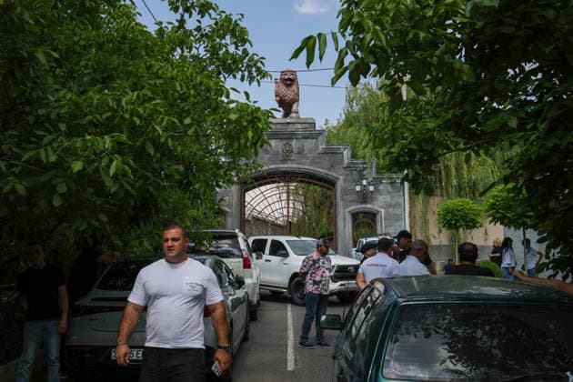 ARMENIA, KOTAYK PROVINCE - JULY 6, 2026: Men gather outside the home of Gagik Tsarukyan, Chairman of Prosperous Armenia, in the village of Arinj, northeast of Yerevan. According to Tsarukyan s spokeswoman, searches occur across almost all of the offices of companies owned by his Multi Group Concern Armenia  - ZUMAt113 20260706_zaa_t113_333 Copyright: xAlexanderxPatrinx