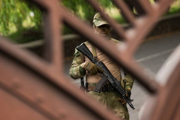 ARMENIA, KOTAYK PROVINCE - JULY 6, 2026: A National Security Service operative stands guard outside the home of Gagik Tsarukyan, Chairman of Prosperous Armenia, in the village of Arinj, northeast of Yerevan. According to his spokeswoman, searches occur across almost all of the offices of companies owned by Tsarukyan s Multi Group Concern. Alexander Patrin TASS  94748771