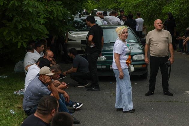 ARMENIA, KOTAYK PROVINCE - JULY 6, 2026: Citizens crowd outside the home of Gagik Tsarukyan, Chairman of Prosperous Armenia, in the village of Arinj, northeast of Yerevan. According to his spokeswoman, searches occur across almost all of the offices of companies owned by Tsarukyan s Multi Group Concern. Alexander Patrin TASS  94750453