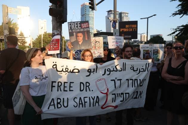 Protest in Tel Aviv Calls for Release of Palestinian Doctor Hussam Abu Safiya TEL AVIV, ISRAEL JULY 6, 2026: Demonstrators gather outside the Government Complex at Kaplan Street in Tel Aviv to demand the immediate release of Palestinian doctor Hussam Abu Safiya. Protesters carried banners and placards calling for his release, expressing concern over his reported detention conditions, and urging protection for medical personnel and political prisoners. The demonstration was held in response to claims by supporters and his legal representative regarding his treatment while in detention. Tel Aviv Israel Copyright: x xSaeedxQaqx xJNAxPressx