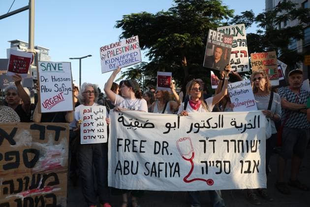 Protest in Tel Aviv Calls for Release of Palestinian Doctor Hussam Abu Safiya TEL AVIV, ISRAEL JULY 6, 2026: Demonstrators gather outside the Government Complex at Kaplan Street in Tel Aviv to demand the immediate release of Palestinian doctor Hussam Abu Safiya. Protesters carried banners and placards calling for his release, expressing concern over his reported detention conditions, and urging protection for medical personnel and political prisoners. The demonstration was held in response to claims by supporters and his legal representative regarding his treatment while in detention. Tel Aviv Israel Copyright: x xSaeedxQaqx xJNAxPressx