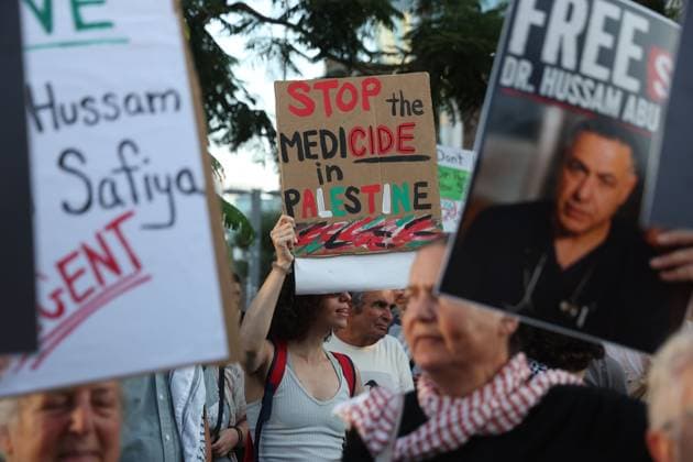 Protest in Tel Aviv Calls for Release of Palestinian Doctor Hussam Abu Safiya TEL AVIV, ISRAEL JULY 6, 2026: Demonstrators gather outside the Government Complex at Kaplan Street in Tel Aviv to demand the immediate release of Palestinian doctor Hussam Abu Safiya. Protesters carried banners and placards calling for his release, expressing concern over his reported detention conditions, and urging protection for medical personnel and political prisoners. The demonstration was held in response to claims by supporters and his legal representative regarding his treatment while in detention. Tel Aviv Israel Copyright: x xSaeedxQaqx xJNAxPressx