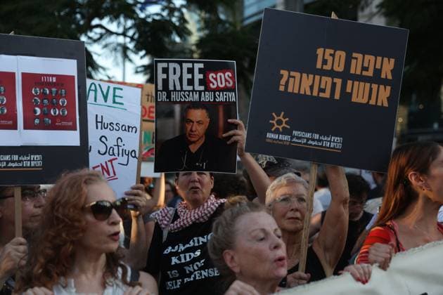 Protest in Tel Aviv Calls for Release of Palestinian Doctor Hussam Abu Safiya TEL AVIV, ISRAEL JULY 6, 2026: Demonstrators gather outside the Government Complex at Kaplan Street in Tel Aviv to demand the immediate release of Palestinian doctor Hussam Abu Safiya. Protesters carried banners and placards calling for his release, expressing concern over his reported detention conditions, and urging protection for medical personnel and political prisoners. The demonstration was held in response to claims by supporters and his legal representative regarding his treatment while in detention. Tel Aviv Israel Copyright: x xSaeedxQaqx xJNAxPressx