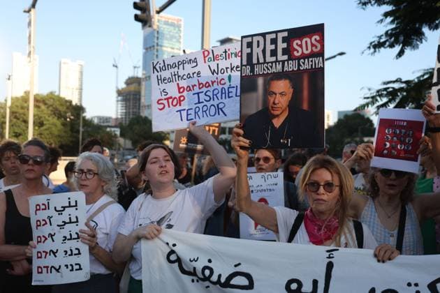 Protest in Tel Aviv Calls for Release of Palestinian Doctor Hussam Abu Safiya TEL AVIV, ISRAEL JULY 6, 2026: Demonstrators gather outside the Government Complex at Kaplan Street in Tel Aviv to demand the immediate release of Palestinian doctor Hussam Abu Safiya. Protesters carried banners and placards calling for his release, expressing concern over his reported detention conditions, and urging protection for medical personnel and political prisoners. The demonstration was held in response to claims by supporters and his legal representative regarding his treatment while in detention. Tel Aviv Israel Copyright: x xSaeedxQaqx xJNAxPressx