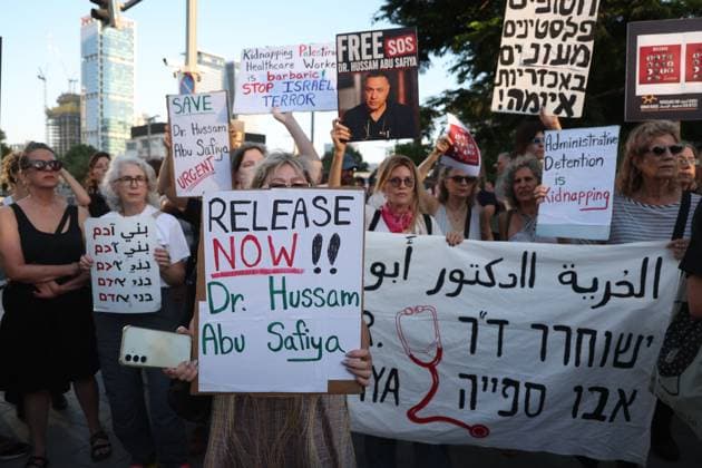 Protest in Tel Aviv Calls for Release of Palestinian Doctor Hussam Abu Safiya TEL AVIV, ISRAEL JULY 6, 2026: Demonstrators gather outside the Government Complex at Kaplan Street in Tel Aviv to demand the immediate release of Palestinian doctor Hussam Abu Safiya. Protesters carried banners and placards calling for his release, expressing concern over his reported detention conditions, and urging protection for medical personnel and political prisoners. The demonstration was held in response to claims by supporters and his legal representative regarding his treatment while in detention. Tel Aviv Israel Copyright: x xSaeedxQaqx xJNAxPressx