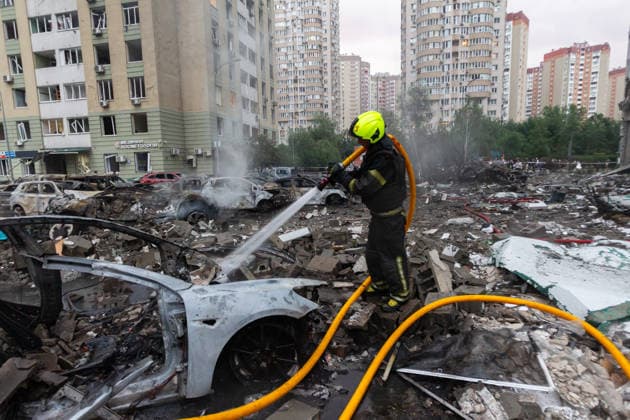 RECORD DATE NOT STATED A rescuer extinguishes a fire in a car destroyed in a massive combined Russian attack, Kyiv, Ukraine, on July 6, 2026. Russian forces launched a large-scale attack on the capital using ballistic and cruise missiles as well as attack drones, causing destruction to apartment buildings and civilian infrastructure across several districts of the city. The Podilskyi district suffered the most severe damage. At least 11 people were killed and 46 others were injured (Photo by Kyrylo Chubotin Ukrinform) Russia launches another massive strike on Kyiv  Copyright: xKyryloxChubotinx