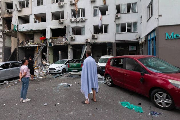 RECORD DATE NOT STATED People stand outside an apartment building damaged in a massive combined Russian attack on Kyiv, Ukraine, on July 6, 2026. Russian forces launched a large-scale attack on the capital using ballistic and cruise missiles as well as attack drones, causing destruction to residential buildings and civilian infrastructure in several districts of the city. The Podilskyi district was hit hardest. At least 11 people were killed and 46 others were injured (Photo by Kyrylo Chubotin Ukrinform) Russia launches another massive strike on Kyiv  Copyright: xKyryloxChubotinx
