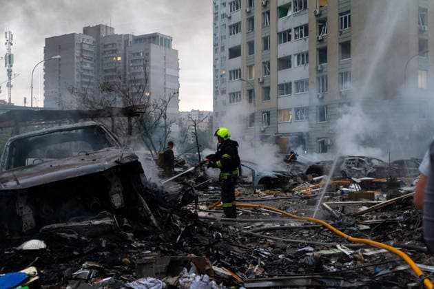 RECORD DATE NOT STATED A firefighter extinguishes a fire in a vehicle destroyed in a massive combined Russian attack on Kyiv, Ukraine, on July 6, 2026. Russian forces launched a large-scale attack on the capital using ballistic and cruise missiles as well as attack drones, causing destruction to residential buildings and civilian infrastructure in several districts of the city. The Podilskyi district was hit hardest. At least 11 people were killed and 46 others were injured (Photo by Kyrylo Chubotin Ukrinform) Russia launches another massive strike on Kyiv  Copyright: xKyryloxChubotinx
