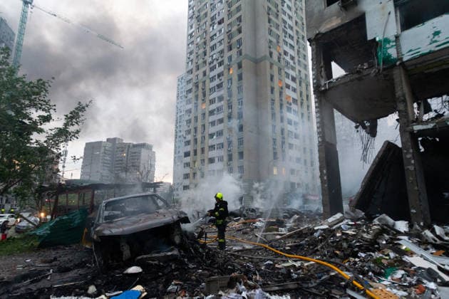 RECORD DATE NOT STATED A firefighter extinguishes a fire in a vehicle destroyed in a massive combined Russian attack on Kyiv, Ukraine, on July 6, 2026. Russian forces launched a large-scale attack on the capital using ballistic and cruise missiles as well as attack drones, causing destruction to residential buildings and civilian infrastructure in several districts of the city. The Podilskyi district was hit hardest. At least 11 people were killed and 46 others were injured (Photo by Kyrylo Chubotin Ukrinform) Russia launches another massive strike on Kyiv  Copyright: xKyryloxChubotinx