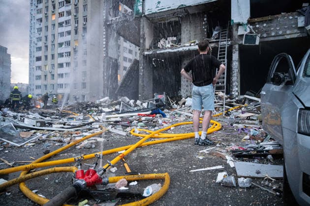 Russia launches another massive strike on Kyiv A young man watches rescuers working at the site of a multi-storey residential building damaged in a massive combined Russian attack, Kyiv, Ukraine, on July 6, 2026. Russian forces launched a large-scale attack on the capital using ballistic and cruise missiles as well as attack drones, causing destruction to apartment buildings and civilian infrastructure across several districts of the city. The Podilskyi district suffered the most severe damage. At least 11 people were killed and 46 others were injured, Credit:Danylo Antoniuk Ukrinform Avalon Ukraine, Kyiv  Copyright: xDanyloxAntoniukx xUkrinformx xAvalonx 1114835960