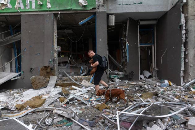 Russia launches another massive strike on Kyiv A man walks his dog past a multi-storey residential building damaged in a massive combined Russian attack, Kyiv, Ukraine, on July 6, 2026. Russian forces launched a large-scale attack on the capital using ballistic and cruise missiles as well as attack drones, causing destruction to apartment buildings and civilian infrastructure across several districts of the city. The Podilskyi district suffered the most severe damage. At least 11 people were killed and 46 others were injured, Credit:Kyrylo Chubotin Ukrinform Avalon Ukraine, Kyiv  Copyright: xKyryloxChubotinx xUkrinformx xAvalonx 1114836813