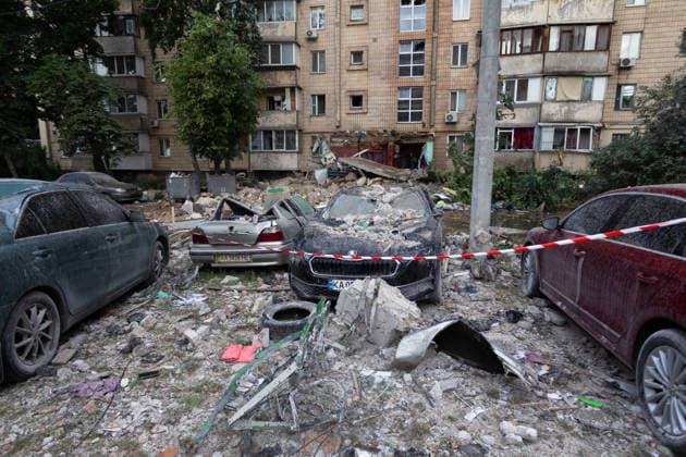 Russian missile hits apartment building in Kyiv™s Podilskyi district Damaged cars stand beside a nine-storey residential building damaged in a massive combined Russian attack in Kyiv™s Podilskyi district, Ukraine, on July 6, 2026. Russian forces launched a large-scale attack on the capital using ballistic and cruise missiles as well as attack drones, causing destruction to apartment buildings and civilian infrastructure across several districts of the city. The Podilskyi district suffered the most severe damage. At least 11 people were killed and 46 others were injured, Credit:Kyrylo Chubotin Ukrinform Avalon Ukraine, Kyiv  Copyright: xKyryloxChubotinx xUkrinformx xAvalonx 1114838991