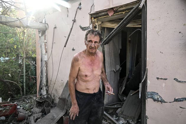 RECORD DATE NOT STATED A man stands outside a residential building damaged in a Russian guided bomb attack in Zaporizhzhia, Ukraine, on July 5, 2026. Russian forces struck the city with two guided aerial bombs. One bomb hit near a multi-storey residential building, while the other struck a private residential area. The attack damaged 35 apartments in the apartment building and destroyed private homes. More than ten people were injured, and a police officer was killed (Photo by Dmytro Smolienko Ukrinform) Russian forces strike Zaporizhzhia with two guided bombs  Copyright: xDmytroxSmolienkox