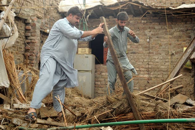 July 6, 2026, Peshawar, Peshawar, Pakistan: Severe Storm and Heavy Rain Lash Peshawar, Leaving Widespread Damage and Multiple Injuries..Peshawar, Pakistan, July, 06: Torrential rain and a powerful windstorm caused widespread destruction across Peshawar, uprooting trees, damaging homes, and flooding major roads. In one incident, the collapse of a house roof left four women and several children seriously injured. Streets in several areas were submerged, resembling ponds and disrupting daily life as rescue and emergency teams responded to the affected locations. Peshawar Pakistan  - ZUMAa217 20260706_znp_a217_020 Copyright: xHussainxAlix