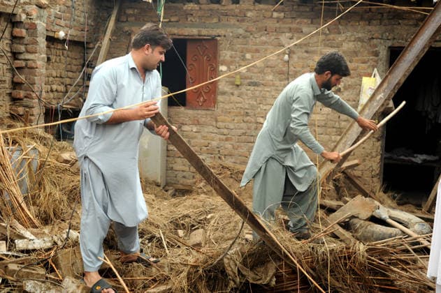 July 6, 2026, Peshawar, Peshawar, Pakistan: Severe Storm and Heavy Rain Lash Peshawar, Leaving Widespread Damage and Multiple Injuries..Peshawar, Pakistan, July, 06: Torrential rain and a powerful windstorm caused widespread destruction across Peshawar, uprooting trees, damaging homes, and flooding major roads. In one incident, the collapse of a house roof left four women and several children seriously injured. Streets in several areas were submerged, resembling ponds and disrupting daily life as rescue and emergency teams responded to the affected locations. Peshawar Pakistan  - ZUMAa217 20260706_znp_a217_022 Copyright: xHussainxAlix