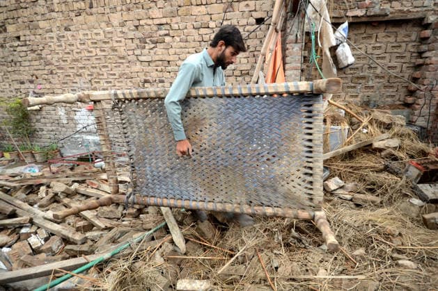 July 6, 2026, Peshawar, Peshawar, Pakistan: Severe Storm and Heavy Rain Lash Peshawar, Leaving Widespread Damage and Multiple Injuries..Peshawar, Pakistan, July, 06: Torrential rain and a powerful windstorm caused widespread destruction across Peshawar, uprooting trees, damaging homes, and flooding major roads. In one incident, the collapse of a house roof left four women and several children seriously injured. Streets in several areas were submerged, resembling ponds and disrupting daily life as rescue and emergency teams responded to the affected locations. Peshawar Pakistan  - ZUMAa217 20260706_znp_a217_032 Copyright: xHussainxAlix