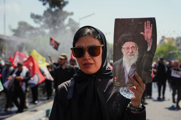 Tehran Funeral Procession For Khamenei A mourner holds a portrait of Iran s slain supreme leader Ayatollah Ali Khamenei as people attend the funeral procession of him and his family members in Tehran on July 6, 2026. Vast crowds gathered for the funeral procession of Iran s slain supreme leader Ali Khamenei in Tehran on July 6, with authorities estimating millions were on the streets in numbers that could rival those of his predecessor s farewell nearly four decades ago. Tehran Tehran Iran Copyright: xArezoox