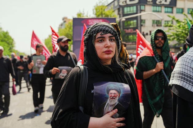 Tehran Funeral Procession For Khamenei A mourner holds a portrait of Iran s slain supreme leader Ayatollah Ali Khamenei as people attend the funeral procession of him and his family members in Tehran on July 6, 2026. Vast crowds gathered for the funeral procession of Iran s slain supreme leader Ali Khamenei in Tehran on July 6, with authorities estimating millions were on the streets in numbers that could rival those of his predecessor s farewell nearly four decades ago. Tehran Tehran Iran Copyright: xArezoox