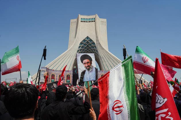 Tehran Funeral Procession For Khamenei A mourner holds a portrait of Iran s supreme leader Ayatollah Mojtaba Khamenei as people attend the funeral pocession of Iran s slain supreme leader Ayatollah Ali Khamenei and his family members in Tehran on July 6, 2026. Vast crowds gathered for the funeral procession of Iran s slain supreme leader Ali Khamenei in Tehran on July 6, with authorities estimating millions were on the streets in numbers that could rival those of his predecessor s farewell nearly four decades ago. Tehran Tehran Iran Copyright: xArezoox