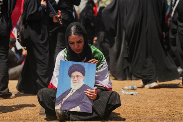 Tehran Funeral Procession For Khamenei A mourner holds a portrait of Iran s slain supreme leader Ayatollah Ali Khamenei as people attend the funeral procession of him and his family members in Tehran on July 6, 2026. Vast crowds gathered for the funeral procession of Iran s slain supreme leader Ali Khamenei in Tehran on July 6, with authorities estimating millions were on the streets in numbers that could rival those of his predecessor s farewell nearly four decades ago. Tehran Tehran Iran Copyright: xArezoox