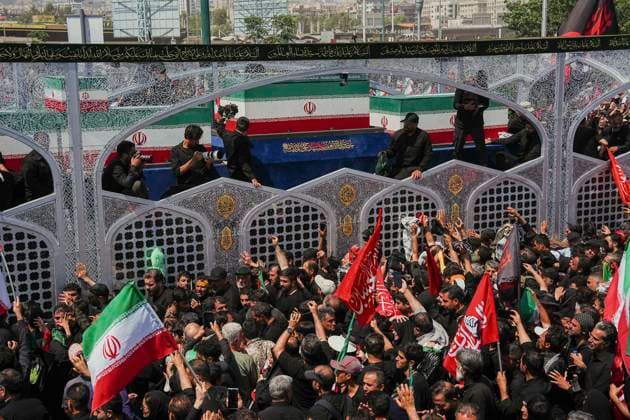 Tehran Funeral Procession For Khamenei Crowds of mourners surround the convoy carrying the coffins of Iran s slain supreme leader Ali Khamenei and members of his family during a funeral procession near Azadi Square in Tehran on July 6, 2026. Vast crowds gathered for the funeral procession of Iran s slain supreme leader Ali Khamenei in Tehran on July 6, with authorities estimating millions were on the streets in numbers that could rival those of his predecessor s farewell nearly four decades ago. Tehran Tehran Iran Copyright: xArezoox