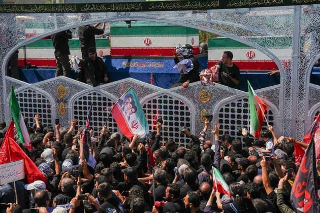 Tehran Funeral Procession For Khamenei Crowds of mourners surround the convoy carrying the coffins of Iran s slain supreme leader Ali Khamenei and members of his family during a funeral procession near Azadi Square in Tehran on July 6, 2026. Vast crowds gathered for the funeral procession of Iran s slain supreme leader Ali Khamenei in Tehran on July 6, with authorities estimating millions were on the streets in numbers that could rival those of his predecessor s farewell nearly four decades ago. Tehran Tehran Iran Copyright: xArezoox