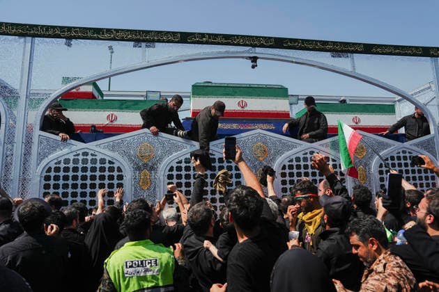 Tehran Funeral Procession For Khamenei Crowds of mourners surround the convoy carrying the coffins of Iran s slain supreme leader Ali Khamenei and members of his family during a funeral procession near Azadi Square in Tehran on July 6, 2026. Vast crowds gathered for the funeral procession of Iran s slain supreme leader Ali Khamenei in Tehran on July 6, with authorities estimating millions were on the streets in numbers that could rival those of his predecessor s farewell nearly four decades ago. Tehran Tehran Iran Copyright: xArezoox
